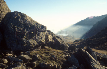 Comp image : ld01204 : Looking into the sun from Swirl How, in the English Lake District, with cloud in the Greenburn valley below